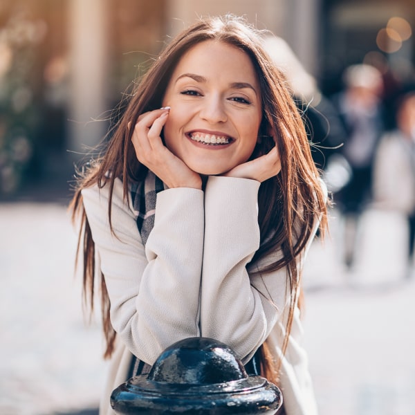 A girl in braces smiles